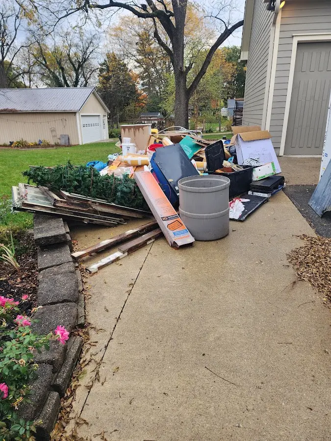 Dumpster being loaded with debris for Residential Dumpster Rental in Bon Secour